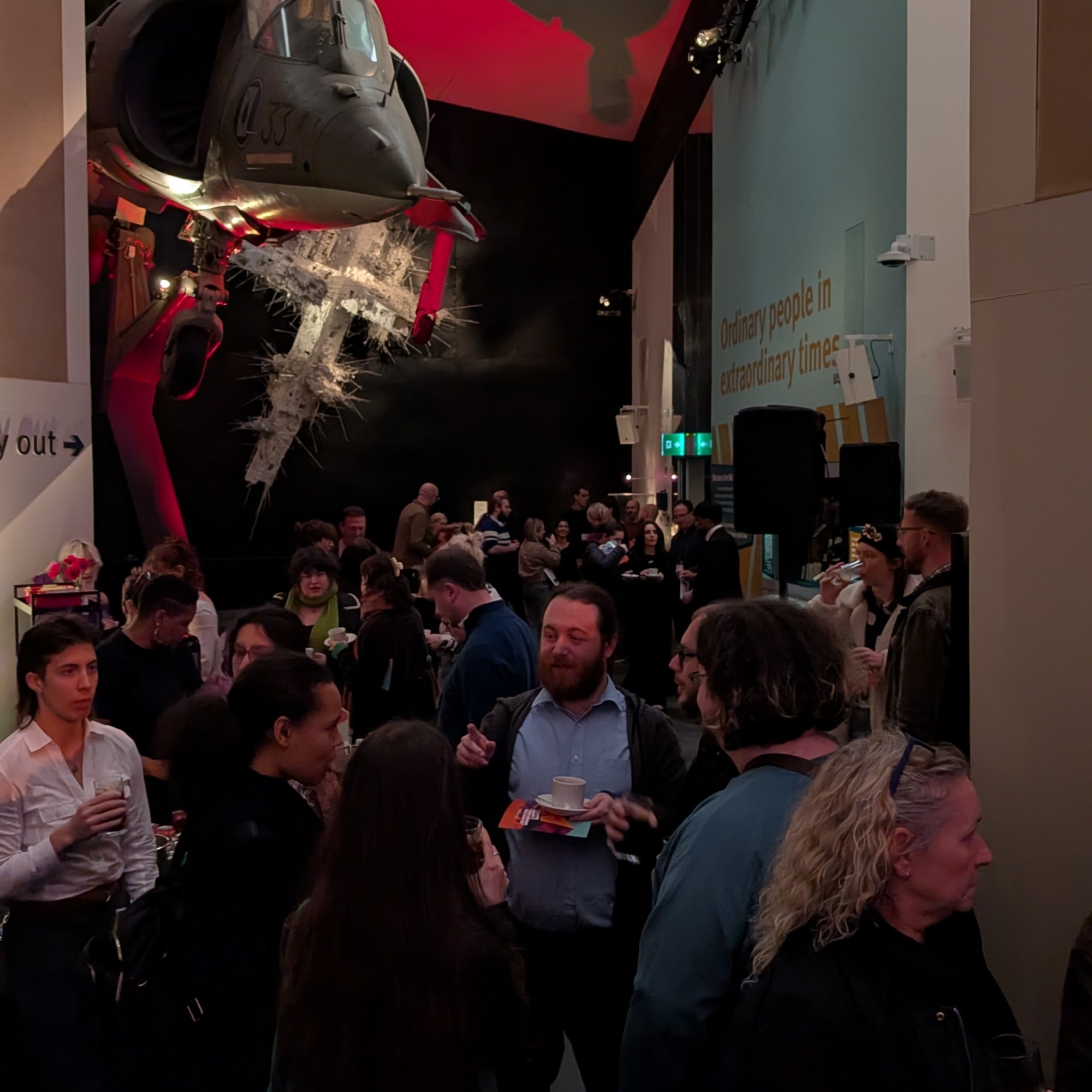 The audience gathers for speeches at the Young Producers Exhibition at Imperial War Museum North
